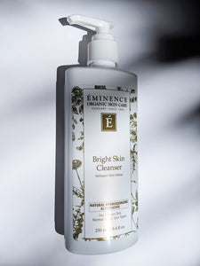 a white bottle of the bright skin cleanser by Eminence