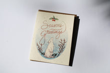 Load image into Gallery viewer, a plantable seed card - the card has a textured look from the seeds imbedded in the paper. There is a bunny drawing on this one that says &quot;Season&#39;s Greetings

