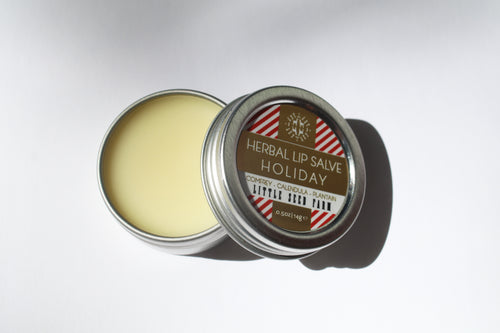 a small tin of holiday lip balm by Little Seed Farm