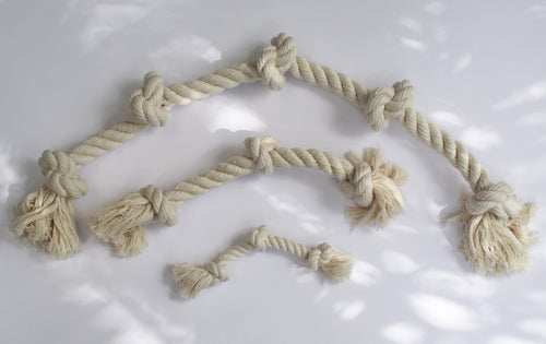 three dog ropes in varying sizes laying next to each other