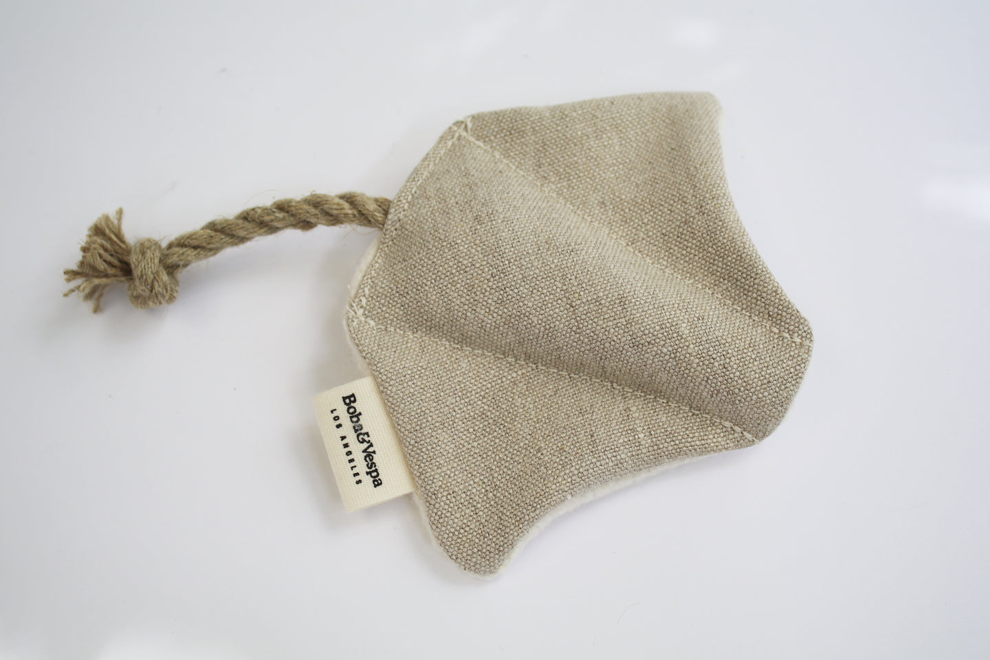 an up close look at a stingray cat toy made of hemp and organic cotton. The stingray has a rope tail.