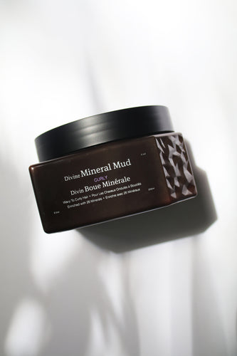 a jar of Divine Mineral Mud for curl hair by Saphira