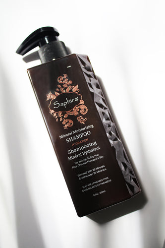 a bottle of mineral moisturizing shampoo by Saphira - the bottle has a pump lid