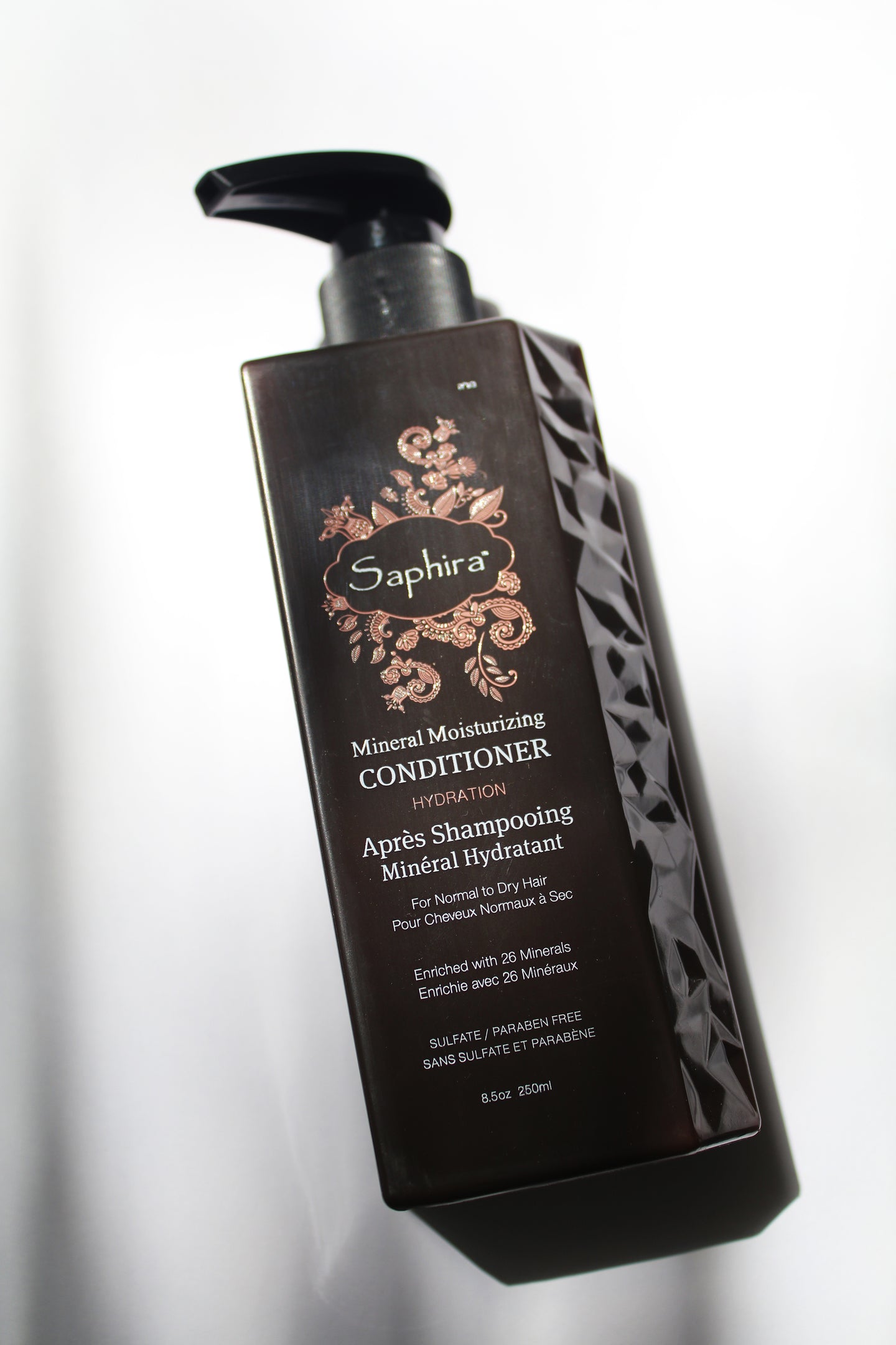 a bottle of mineral moisturizing conditioner by Saphira - the bottle has a pump lid