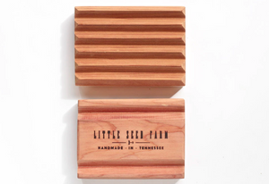 the front and back side of the wooden soap dish. The back side of the dish says "Little Seed Farm Handmade in Tennessee"