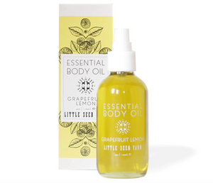 a bottle of grapefruit lemon body oil by Little Seed Farm