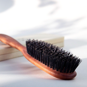 a closer look at the wooden brush with boar bristles