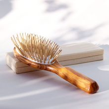 Load image into Gallery viewer, a natural wooden brush with light wood bristles
