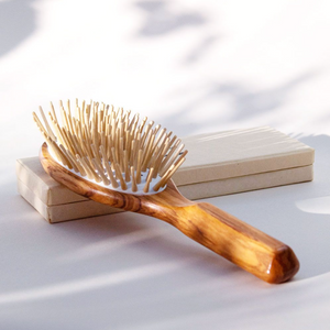 a natural wooden brush with light wood bristles
