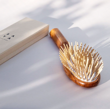 Load image into Gallery viewer, a natural wooden brush with light wood bristles

