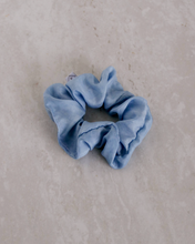 Load image into Gallery viewer, a close up of a light blue colored scrunchie

