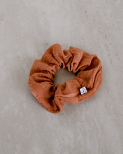 Load image into Gallery viewer, a burnt orange colored gauze scrunchie
