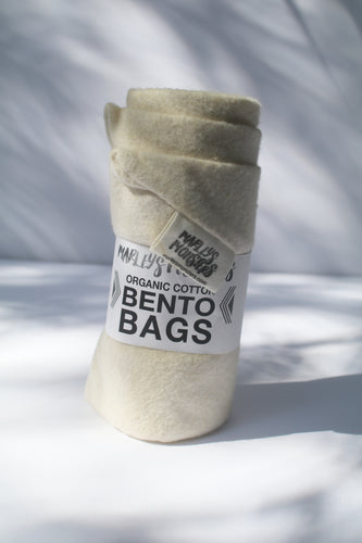 a bundle of cotton bento bags