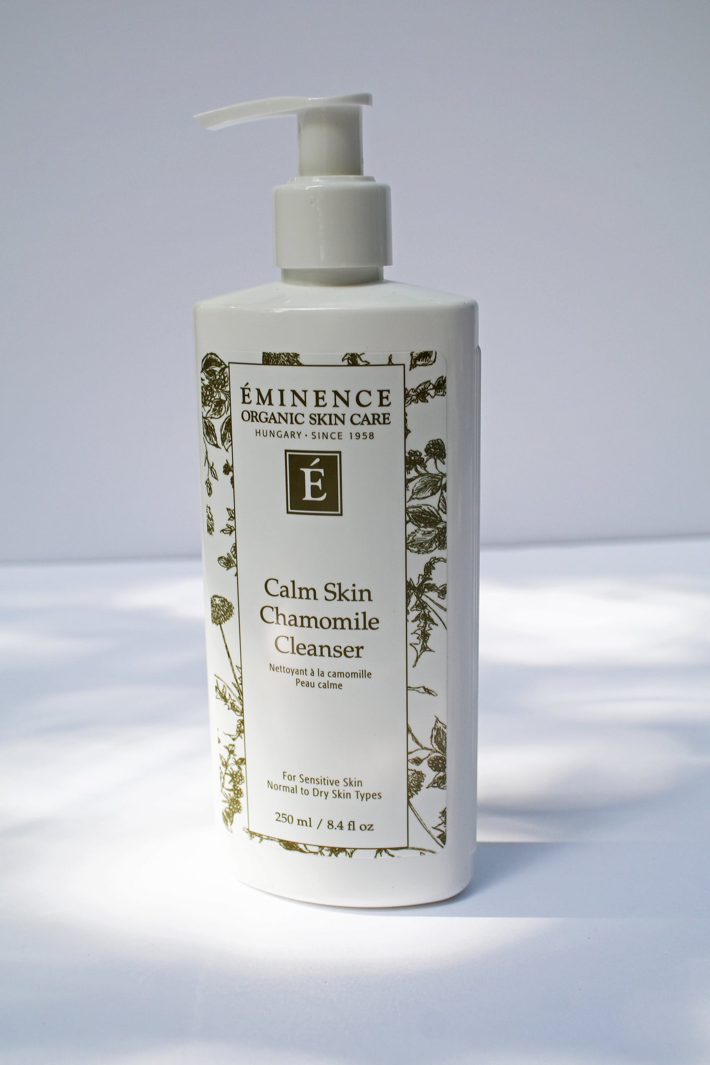 a bottle of the calm skin chamomile cleanser by Eminence