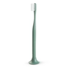 Load image into Gallery viewer, a close up of the green biodegradable toothbrush made of hemp
