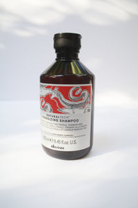 a bottle of "Natural Tech Energizing Shampoo" by Davines