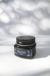 a black jar of "Heart of Glass Intense Treatment" by Davines