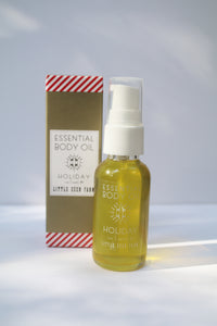 a mini bottle of holiday body oil by Little Seed Farm