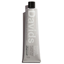 Load image into Gallery viewer, a tube of David&#39;s Natural Toothpaste. it says &quot;Premium Natural Toothpaste. Whitening, Antiplaque, Fresh Breath, Flouride Free, Sulfate Free. Charcoal&quot;

