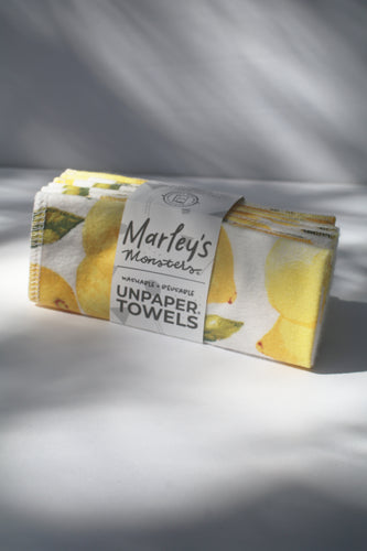 a bundle of unpaper towels with a lemon print on them