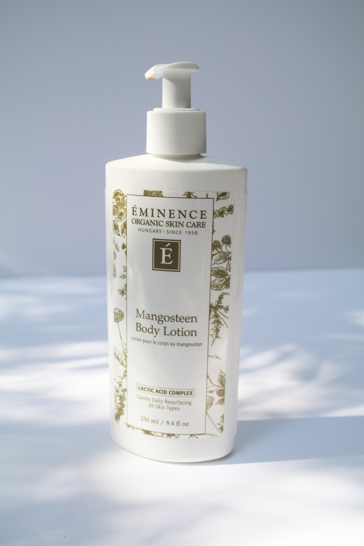 a bottle of mangosteen body lotion by Eminence
