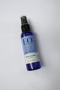 a small spray bottle of hand sanitizer by EO. the bottle says "EO essential oils. Organic Hand Sanitizer. French Lavender Spray. 2 fl oz / 59 ml"