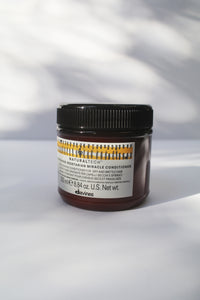 a jar of "Natural Tech Nourishing Vegetarian Miracle Conditioner" by Davines