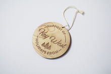 Load image into Gallery viewer, an up close look at a circular wooden ornament that says &quot;Happiest of Holidays from Key West&quot;
