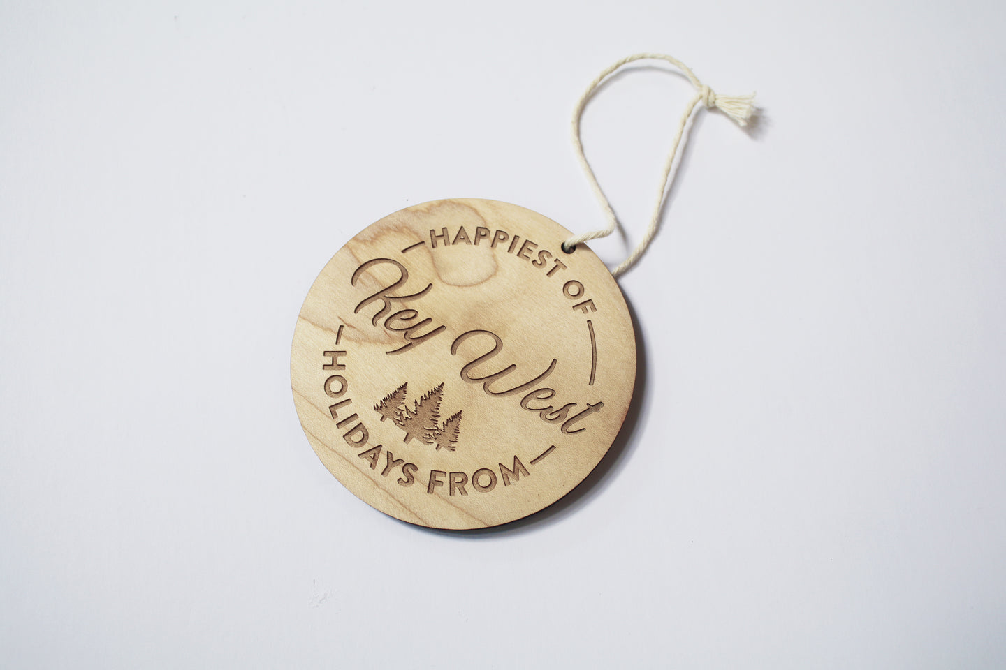 an up close look at a circular wooden ornament that says 