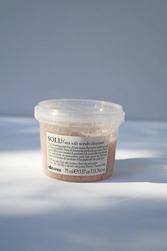 a small jar of SOLU sea salt scrub cleanser by Davines