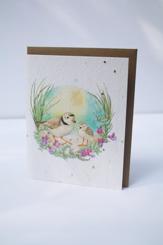 a card with seeds imbedded in the paper to plant and watercolor birds with purple flowers on the front