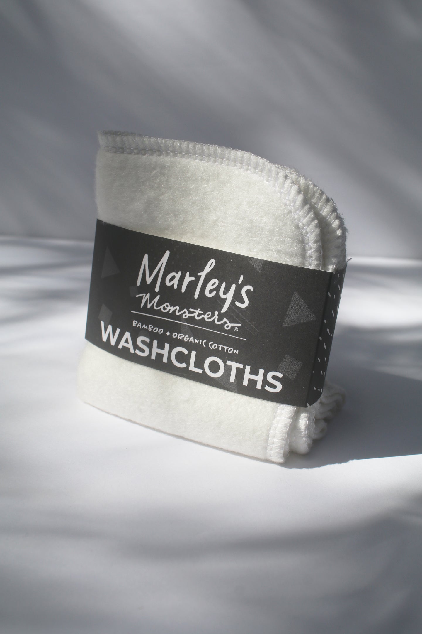 a white bamboo and organic cotton washcloth by Marley's Monsters