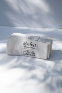 a bundle of unpaper towels in white by Marley's Monsters