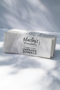 a bundle of unpaper towels in white by Marley's Monsters